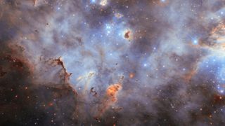 Purple and white clouds of dust and gas swirl around bright twinkling stars in deep space