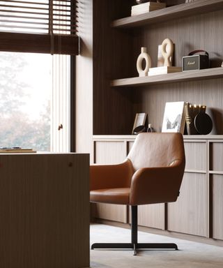 William Haines - Home Office - This home office has orange-toned seating pieces, paired with a straight lines desk, and a wall full of built-in shelves that allow decorative elements to be showcased.