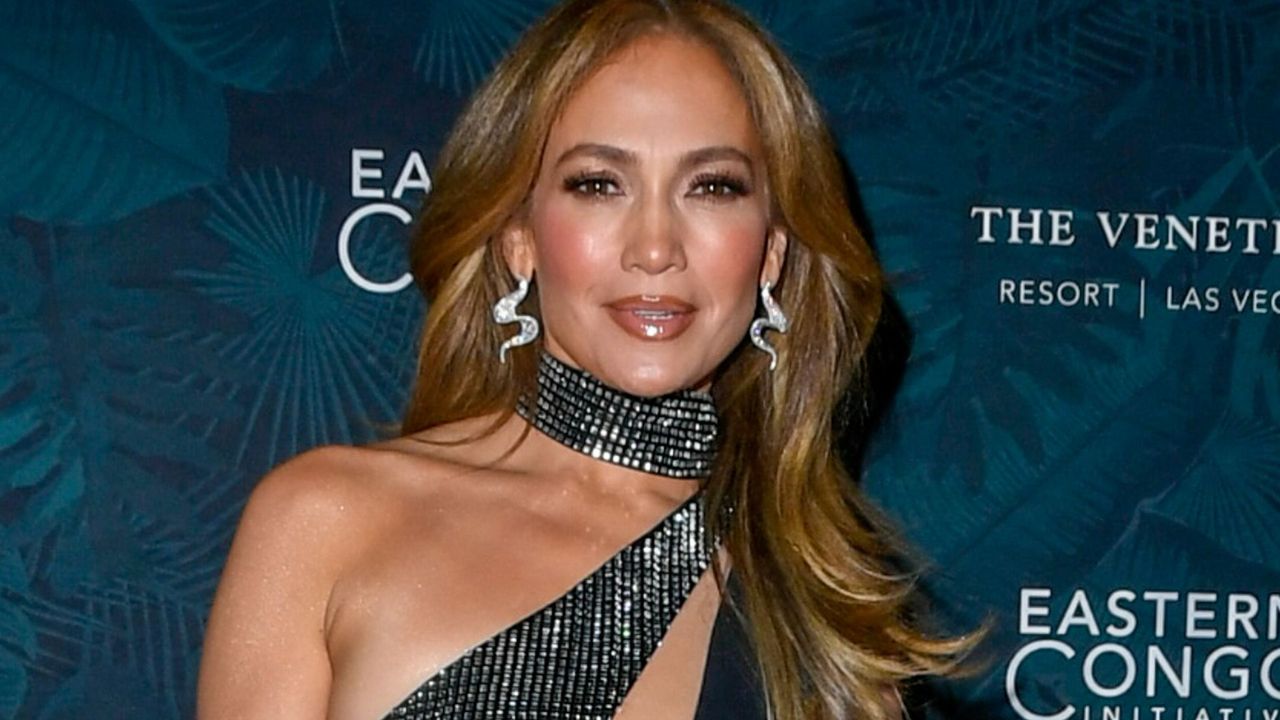 jlo wearing a slinky black dress 