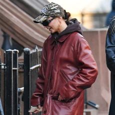 Emily Ratajkowski wearing a burgundy leather jacket