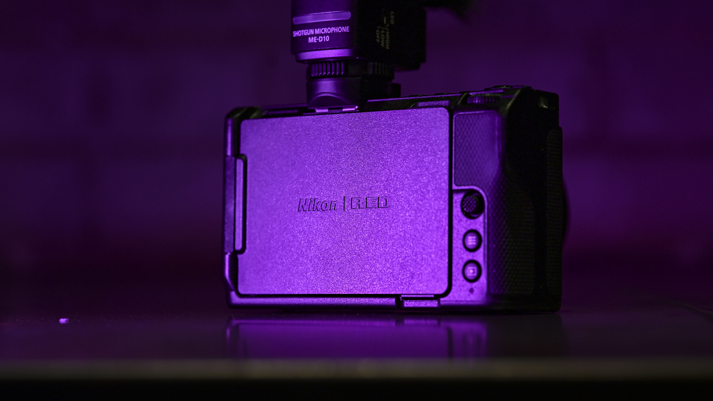 Rear of the Nikon ZR camera under low key magenta lighting