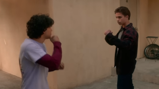 Miguel and Robby fighting in Cobra Kai.