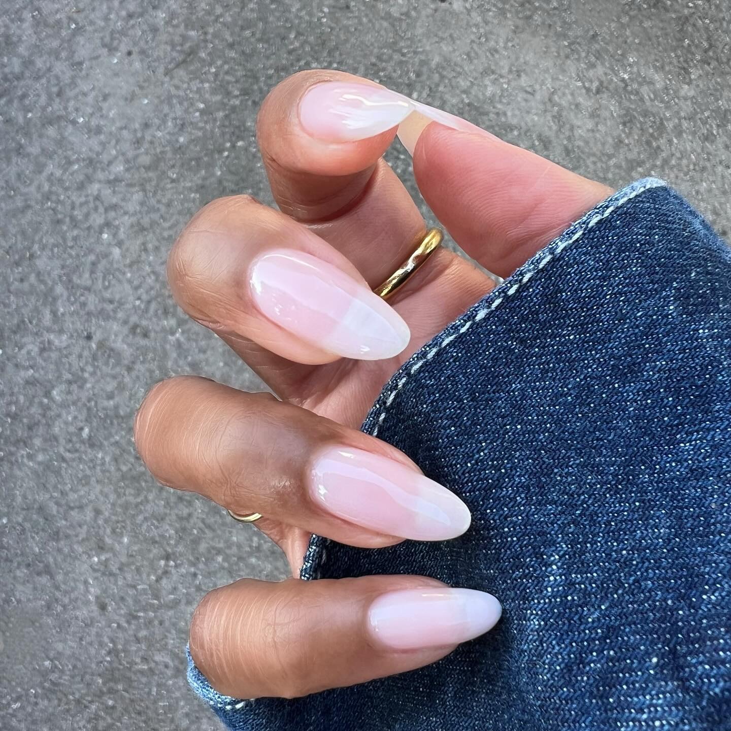 A long, almond-shaped milky manicure