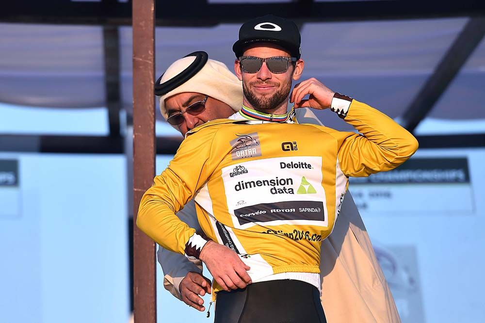 Mark Cavendish (Dimension Data) pulls on the final gold jersey at the Tour of Qatar