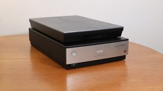 Best film scanner Epson Perfection V850 Pro flatbed film scanner on a wooden table