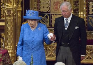Queen Elizabeth II and Prince Charles, Prince of Wales and future King, stand during the State Opening of Parliament