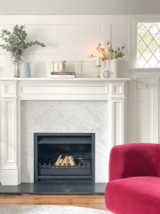 white wooden and marble fire surrond