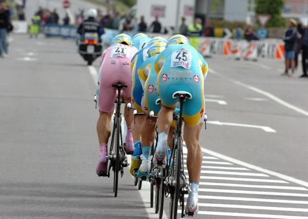 The Astana squad of race leader Alexandre Vinokourov rides in a tight formation.