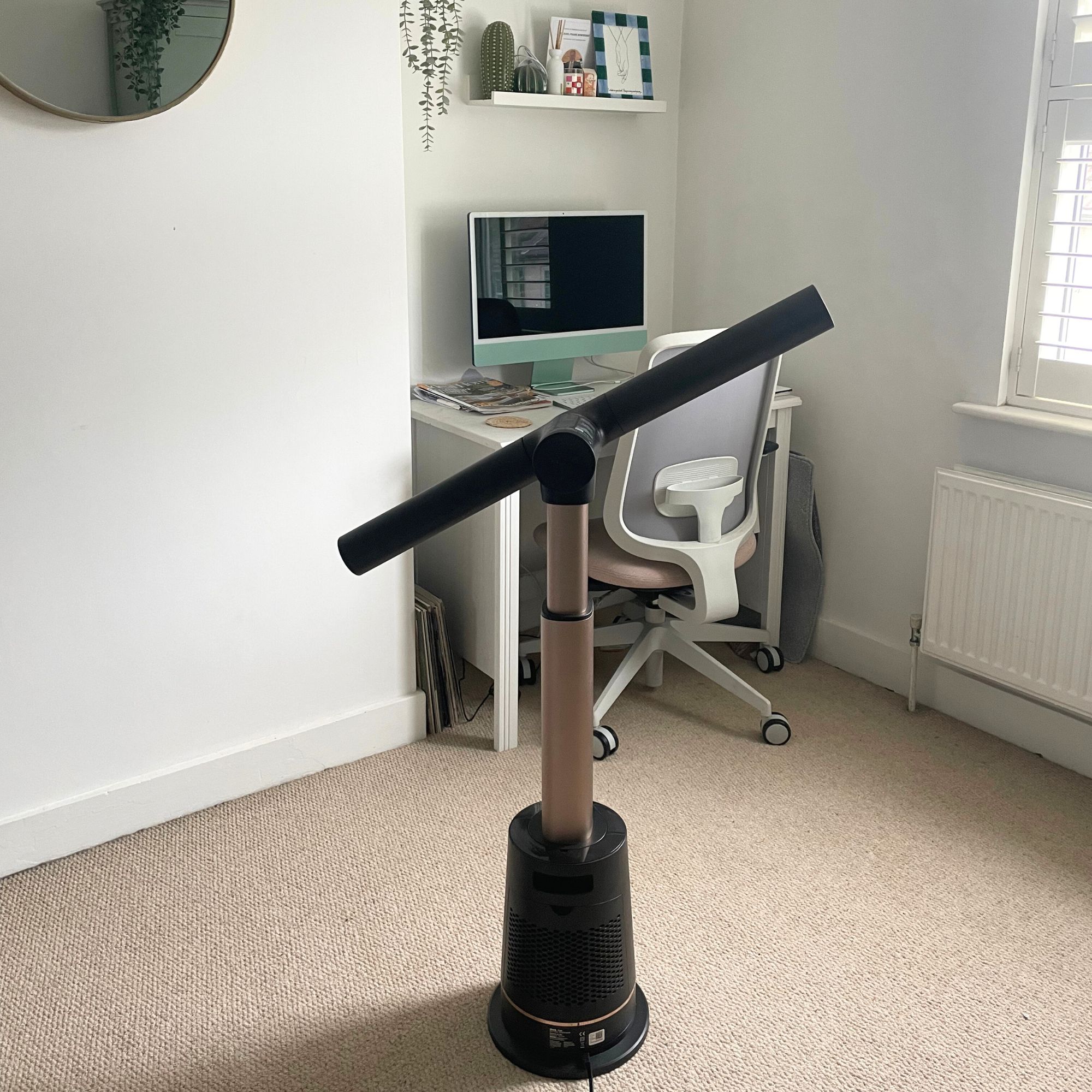 Shark TurboBlade fan sitting on carpet in a white office room