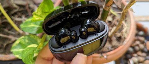 UGREEN HiTune T3 ANC earbuds held inside case with lid open held in one hand