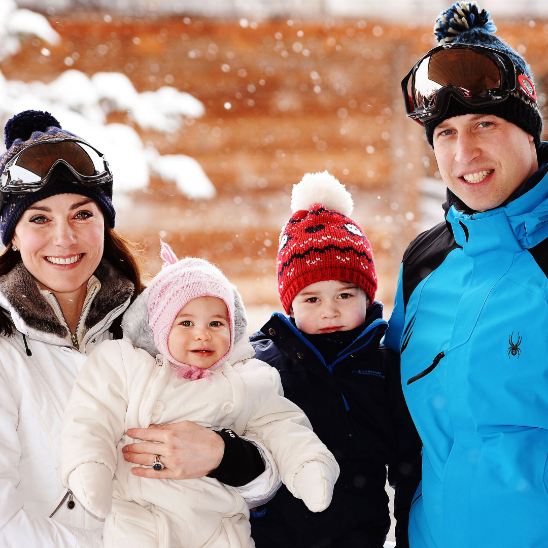 Princess Kate, Prince George, Princess Charlotte, Prince William posing in ski gear in front of a snowy tree