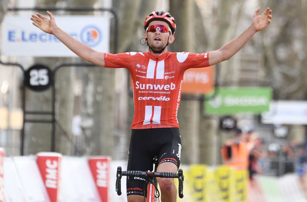 Team Sunweb Belgium rider Tiesj Benoot celebrates as he crosses the finish line at the end of the 1615 km 6th stage of the 78th Paris Nice cycling race stage between Sorgues and Apt on March 13 2020 Photo by Alain JOCARD AFP Photo by ALAIN JOCARDAFP via Getty Images