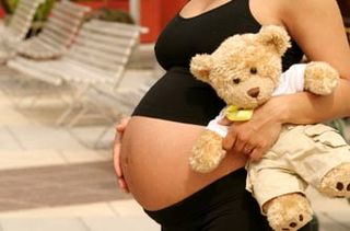 Pregnant woman with teddy