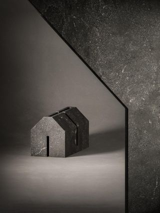 Miniature house in dark stone by John Pawson