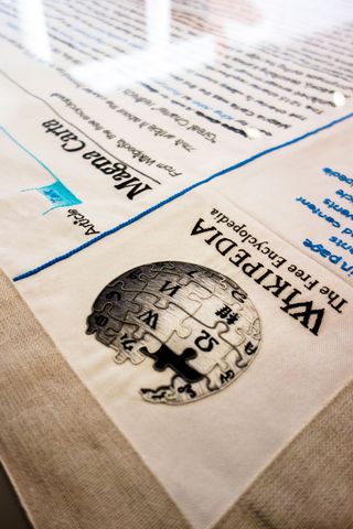 This recreation of the Wikipedia logo was stitched by Janika Mägi.