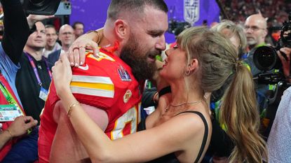 Kansas City Chiefs Travis Kelce (87) kisses girlfriend and singer Taylor Swift following victory vs San Francisco 49ers at Allegiant Stadium. Las Vegas, NV.