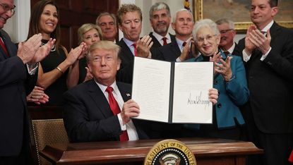 Donald Trump signs executive order to allow small business to skirt Obamacare rules