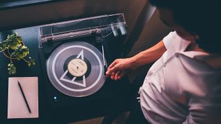 Audio-Technica AT-LP60xBT being operating by a man