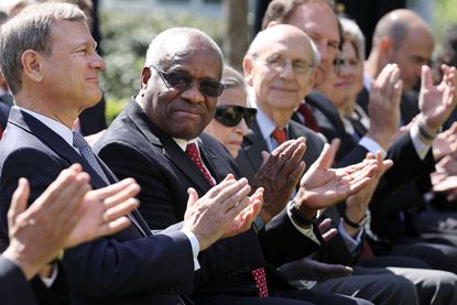 Justice Clarence Thomas and other justices.