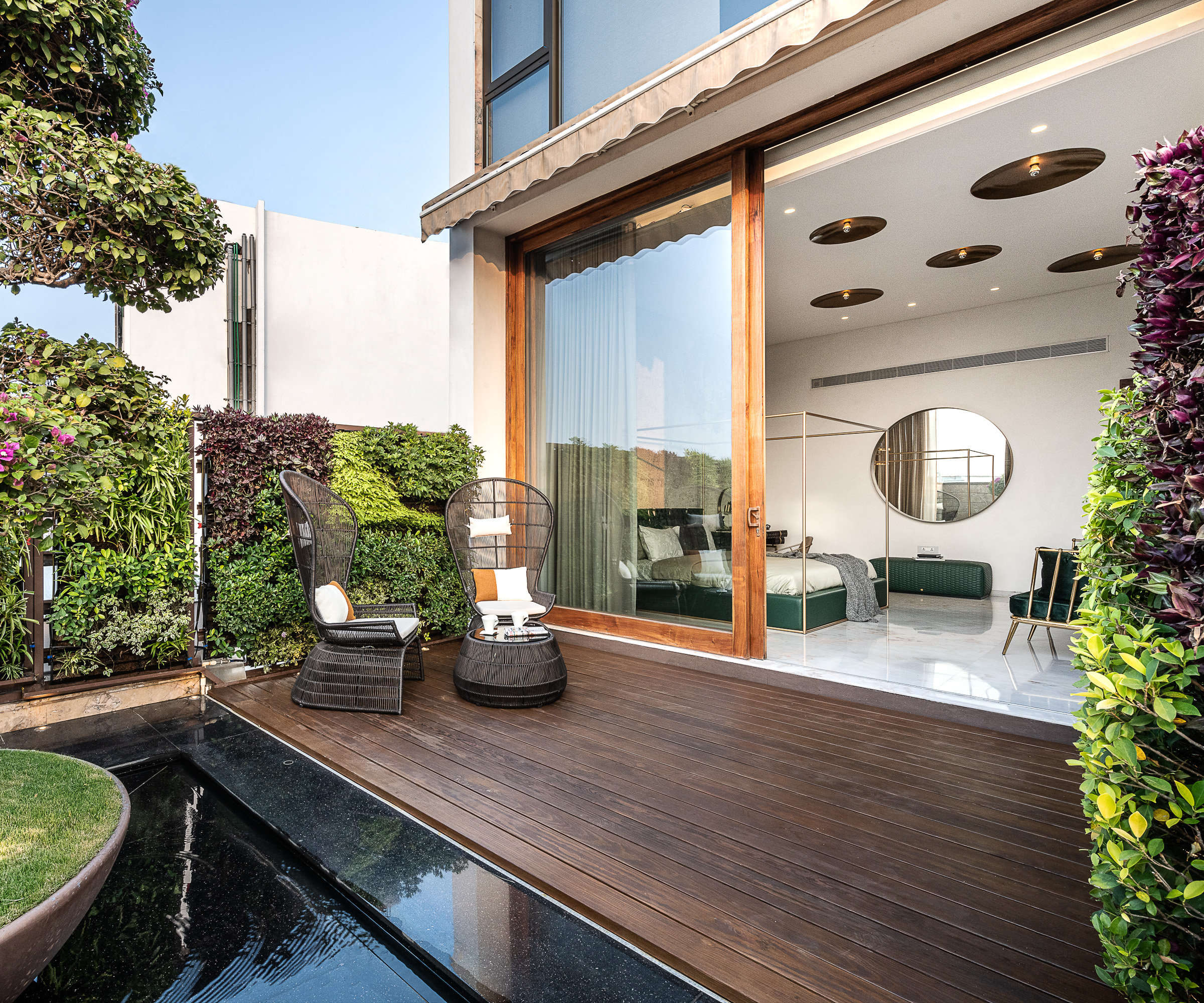 decked bedroom terrace with living walls planted at either end