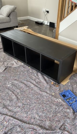 Black cabinet from Ikea on the floor