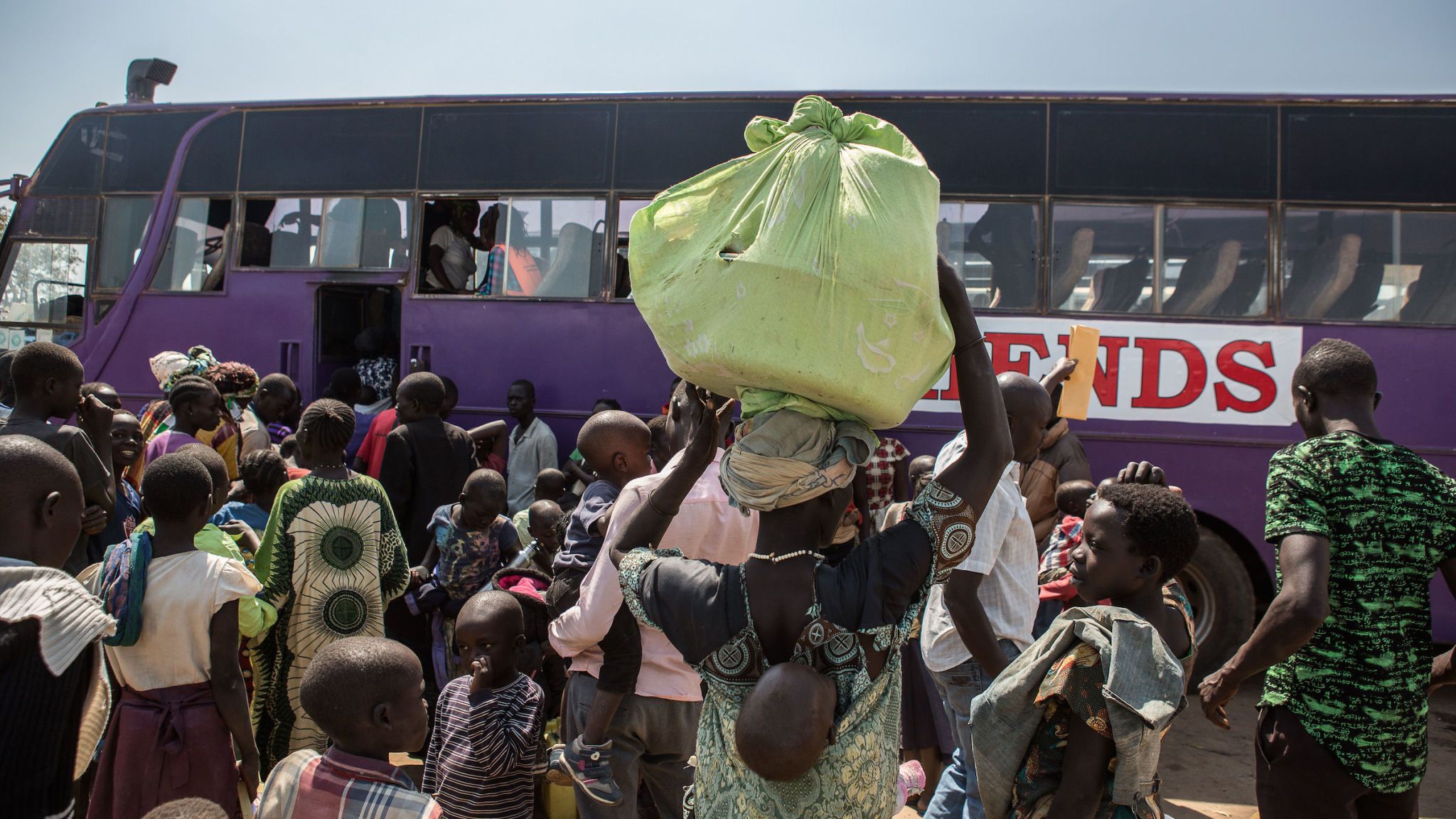 Arm, Human body, Transport, Crowd, Travel, Passenger, Camouflage, Public transport, Tour bus service, Military camouflage,