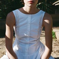 Woman in white poplin dress