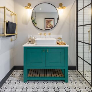 Grey bathroom with teal unit and grey tiles