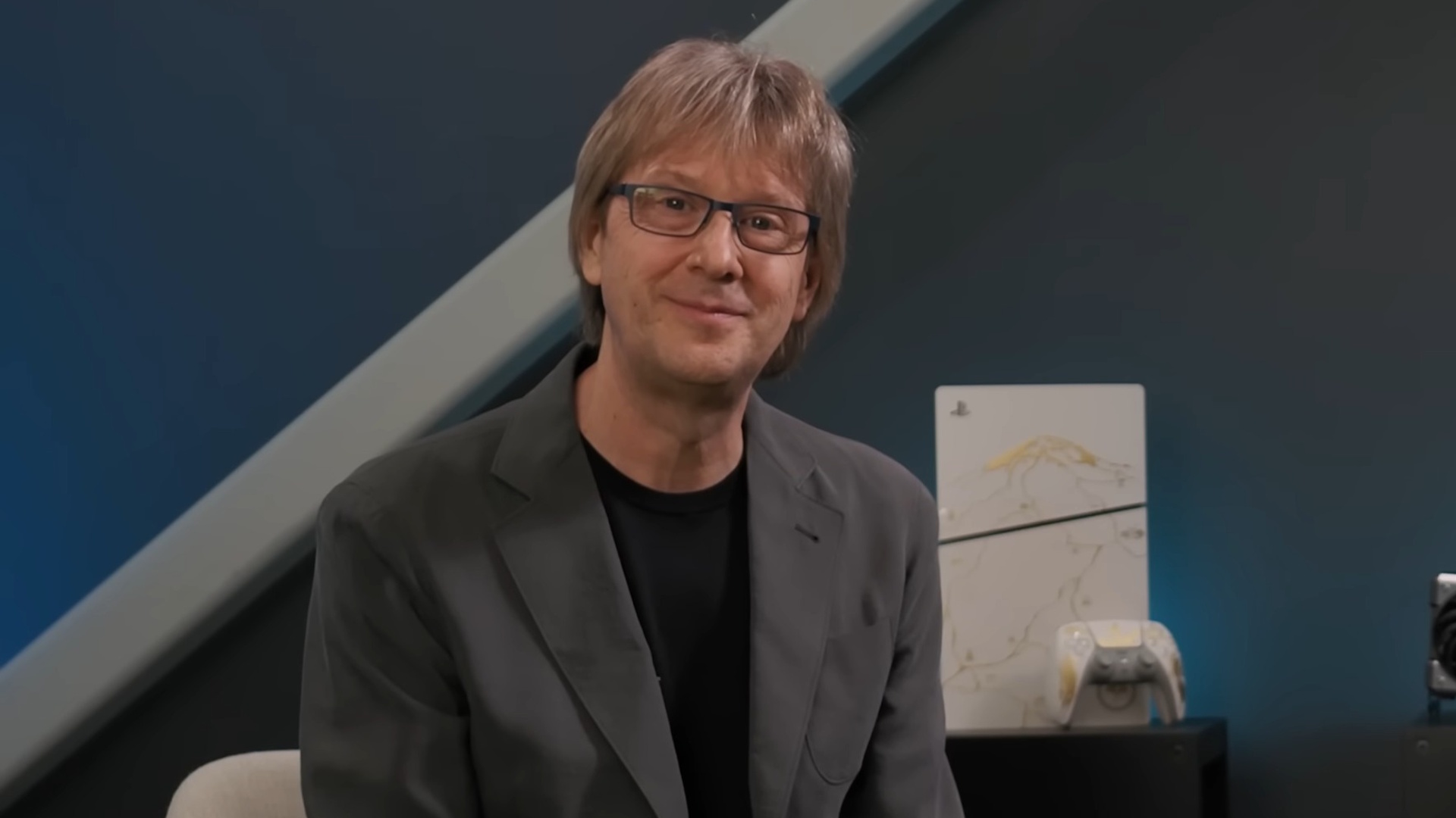 Mark Cerny in front of Ghost of Yotei PS5 model