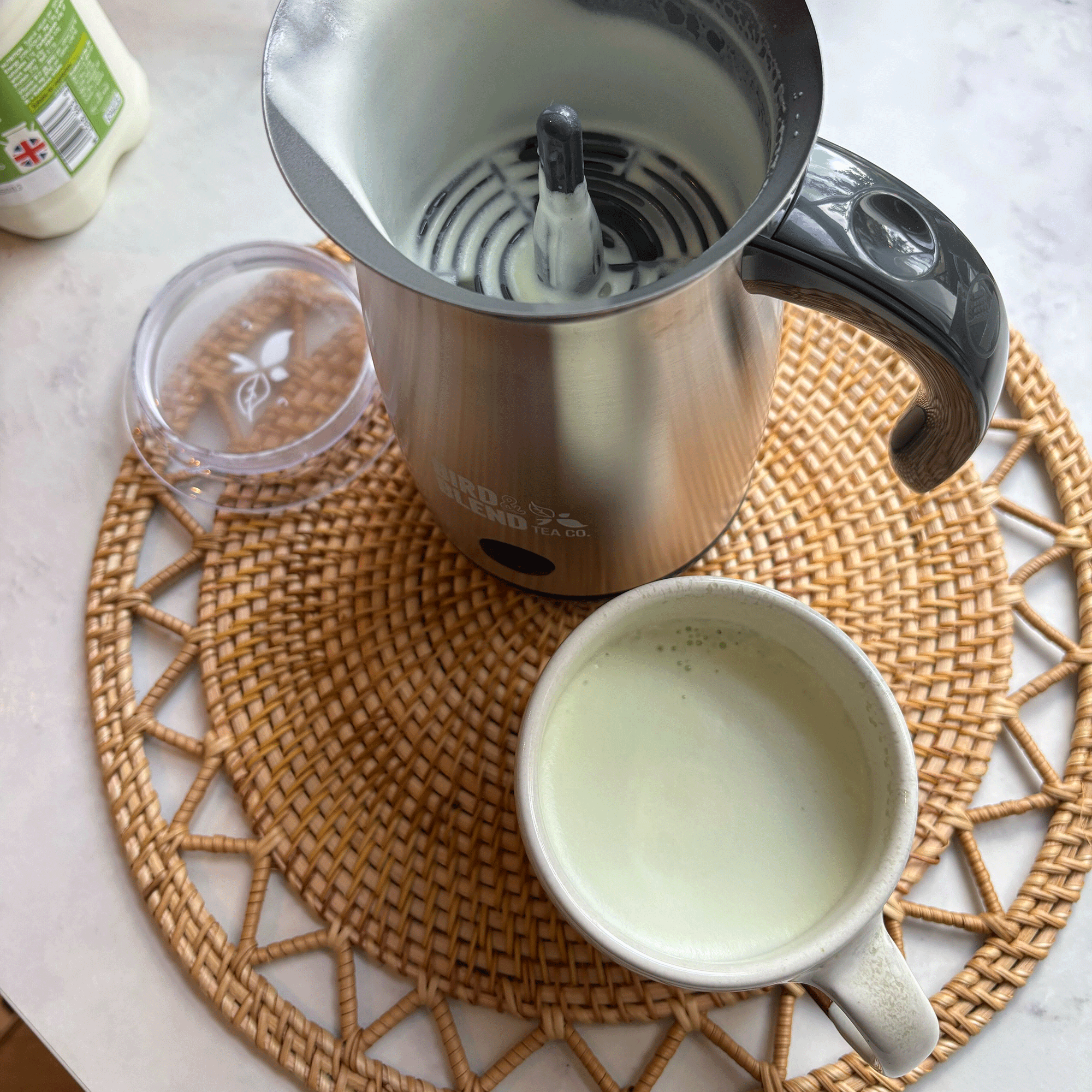 Matcha latte in a mug on a rattan placemat