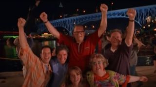 The Drew Carey Show cast raises fists in happiness.