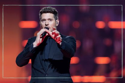 a close up of Michael Buble singing on his Higher tour