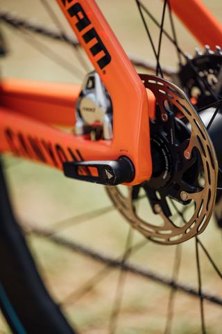 An orange Canyon Aeroad fitted with Thru Axle lever