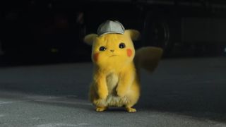 Detective PIkachu looks puzzled while standing near a warehouse in Pokémon Detective Pikachu.