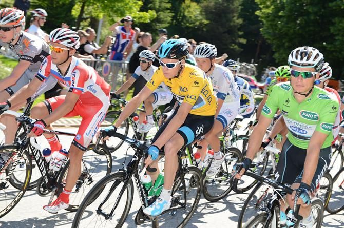 The race leader Chris Froome and green jersey holder Gianni Meersman roll out for stage 6 of the Dauphine