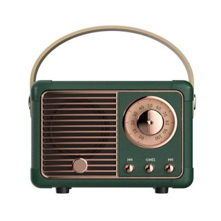 A green retro radio with rose gold detailing and a handle