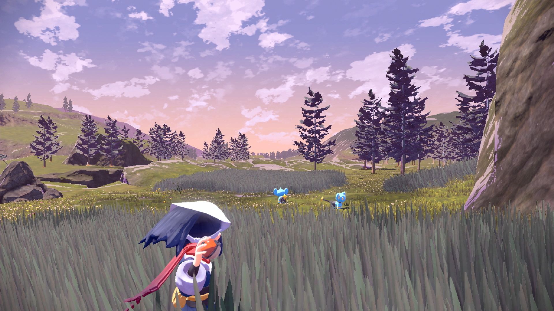 Pokémon Legends Arceus: a trainer sneaking through the tall grass towards some Pokémon