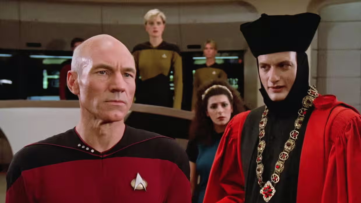 Patrick Stewart as Captain Picard next to Q (John de Lancie) in Star Trek: The Next Generation.