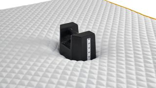 Our testing image shows a 25kg weight placed in the middle of the Eve Premium Hybrid Mattress