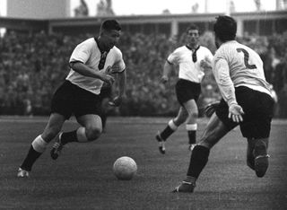 Helmut Rahn on the ball for West Germany against Argentina at the 1958 World Cup.
