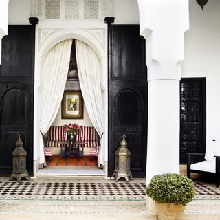 entrance with black wooden door