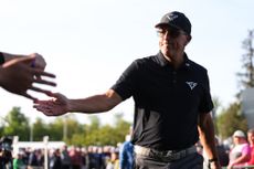 Phil Mickelson high-fives a fan at the 2023 PGA Championship