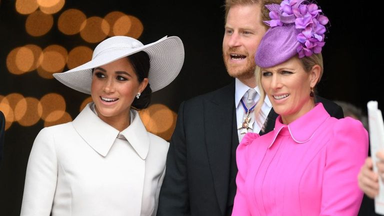 Meghan, Duchess of Sussex, Britain's Prince Harry, Duke of Sussex, and Zara Phillips leave after attending the National Service of Thanksgiving for The Queen's reign at Saint Paul's Cathedral in London on June 3, 2022 as part of Queen Elizabeth II's platinum jubilee celebrations. - Queen Elizabeth II kicked off the first of four days of celebrations marking her record-breaking 70 years on the throne, to cheering crowds of tens of thousands of people. But the 96-year-old sovereign's appearance at the Platinum Jubilee -- a milestone never previously reached by a British monarch -- took its toll, forcing her to pull out of a planned church service.