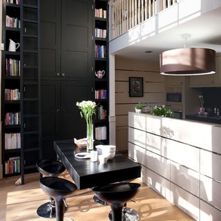 double height black and white kitchen