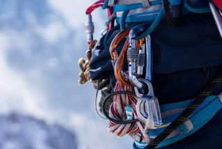 types of belay device: climbing equipment on a harness