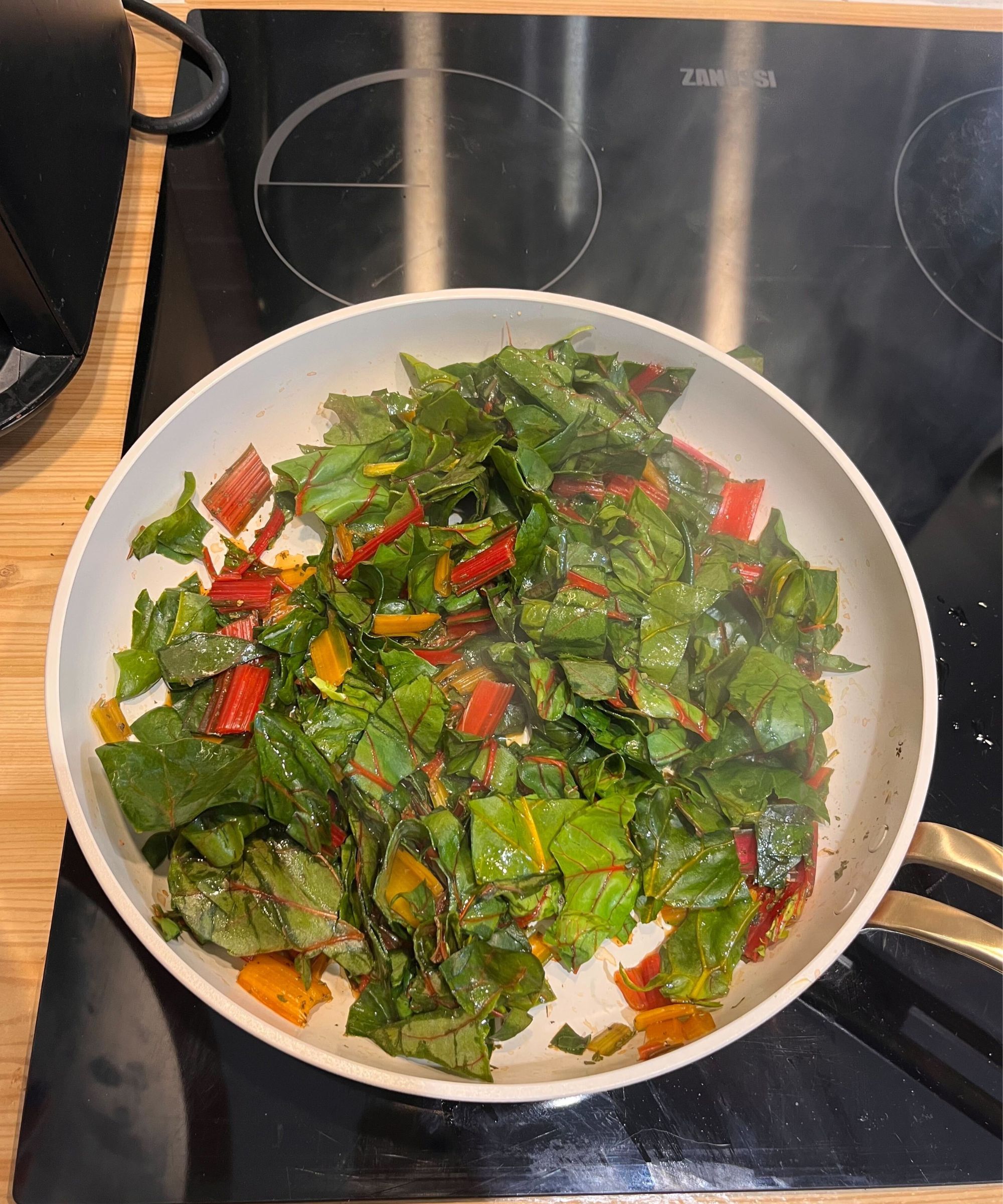I sauteed rainbow chard in the Our Plan pan, pictured here steaming down nice and evenly