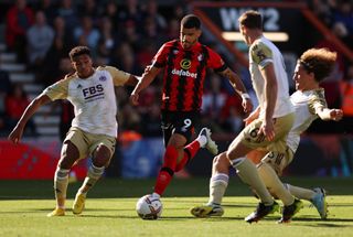 Dominic Solanke of AFC Bournemouth is tackled by James Justin and Wout Faes of Leicester City during the Premier League match between AFC Bournemouth and Leicester City at Vitality Stadium on October 08, 2022 in Bournemouth, England.