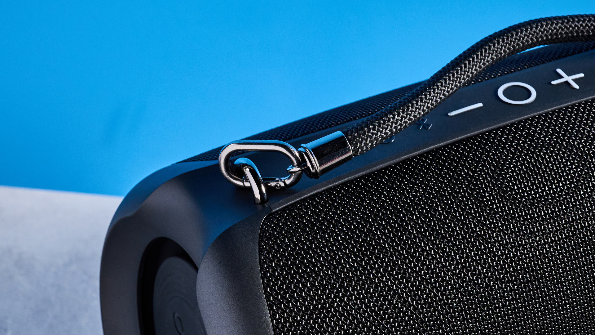 Tribit StormBox Lava Bluetooth Speaker photographed in front of a blue background.