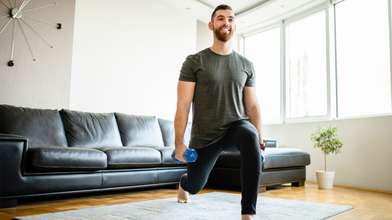 Man doing dumbbell lunges