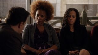 Aunjanue Ellis-Taylor looking at Josh Charles, she’s sitting next to another woman on The Good Wife.